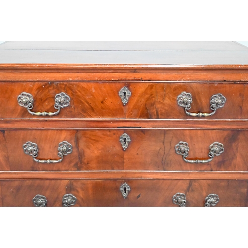 855 - A George III mahogany chest of four long graduated drawers, with later cast brass fittings, raised o... 