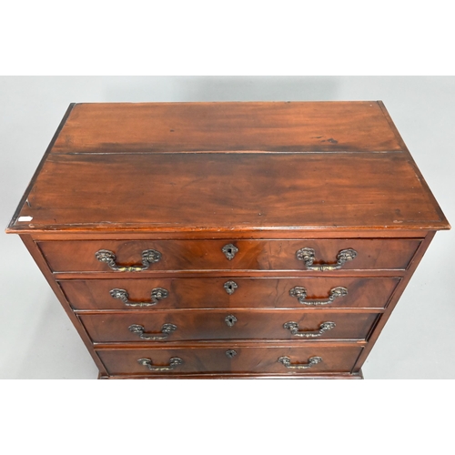 855 - A George III mahogany chest of four long graduated drawers, with later cast brass fittings, raised o... 