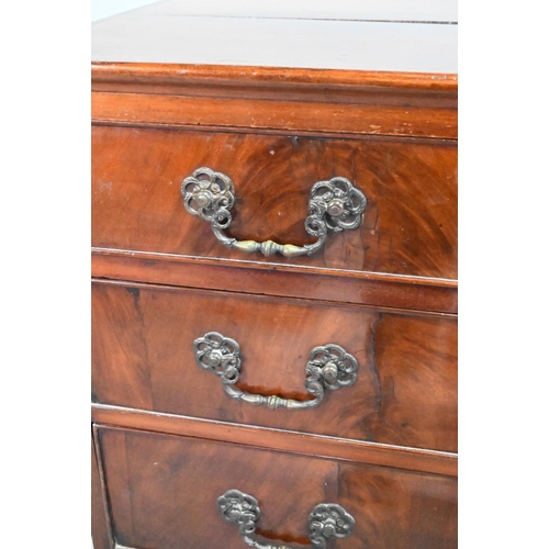 855 - A George III mahogany chest of four long graduated drawers, with later cast brass fittings, raised o... 