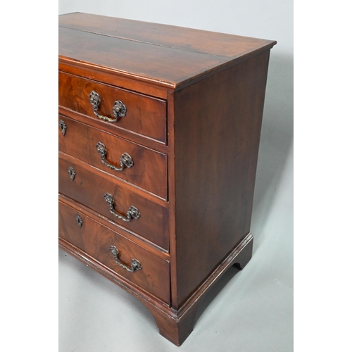 855 - A George III mahogany chest of four long graduated drawers, with later cast brass fittings, raised o... 