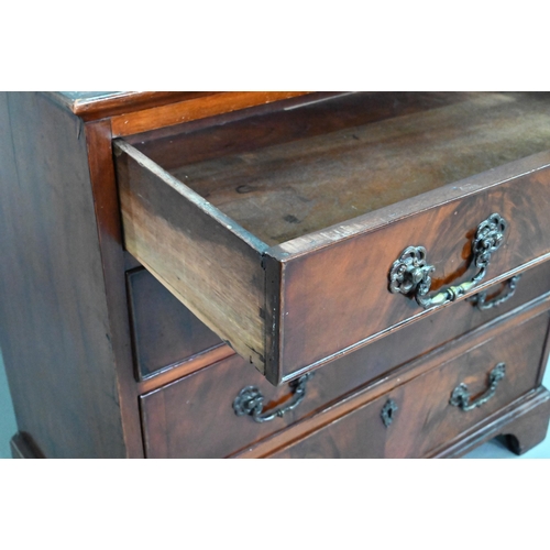 855 - A George III mahogany chest of four long graduated drawers, with later cast brass fittings, raised o... 