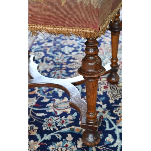 857 - A Queen Anne style walnut framed stool, 19th century, with distressed overstuffed needlepoint seat, ... 