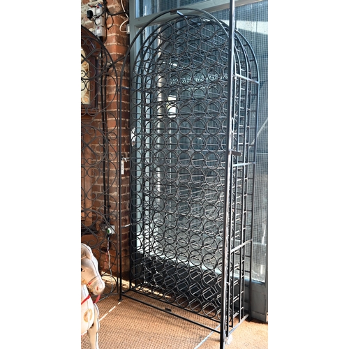 860 - A substantial wrought iron dome-top wine cage for approx. 130 bottles, with twin doors, 93 cm w x 20... 