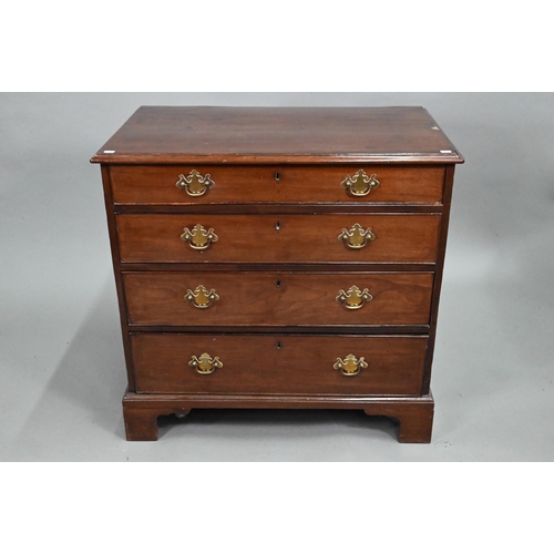 868 - A George III mahogany chest of four long graduated drawers, later brass fittings, raised on shaped b... 