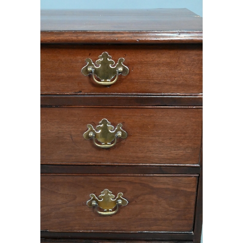 868 - A George III mahogany chest of four long graduated drawers, later brass fittings, raised on shaped b... 