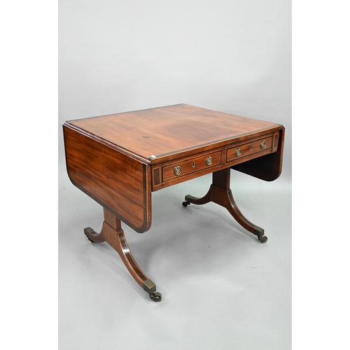 873 - A good Regency rosewood cross-banded mahogany sofa table, the rounded drop leaves over two frieze dr... 