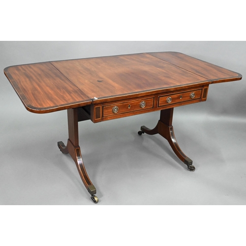 873 - A good Regency rosewood cross-banded mahogany sofa table, the rounded drop leaves over two frieze dr... 