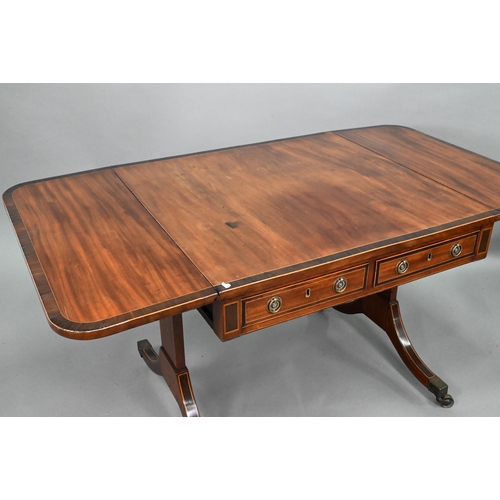 873 - A good Regency rosewood cross-banded mahogany sofa table, the rounded drop leaves over two frieze dr... 