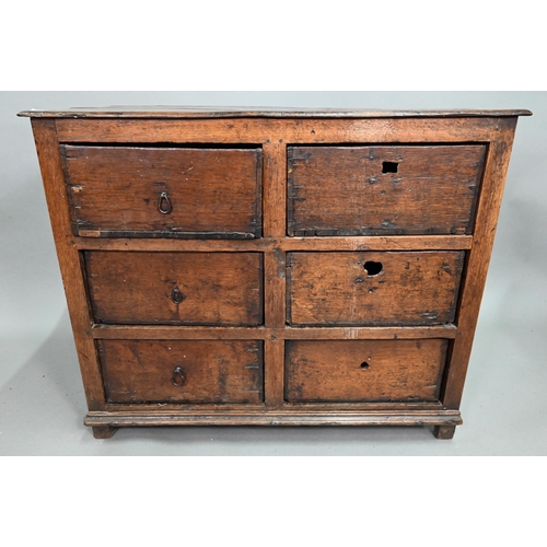 878 - A rustic late 17th/18th century joined oak framed six drawer chest, raised on stile feet, probably N... 