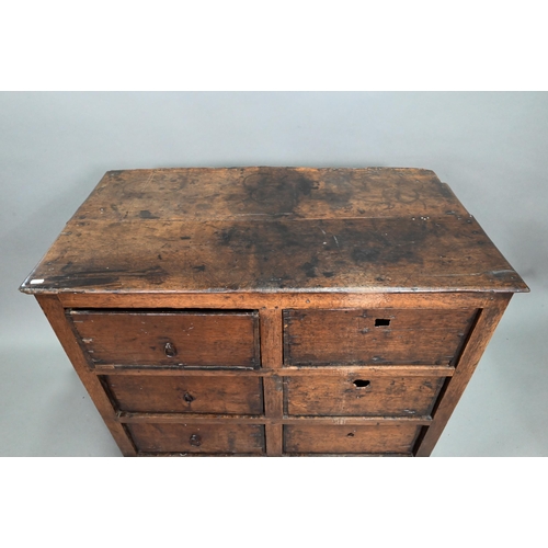 878 - A rustic late 17th/18th century joined oak framed six drawer chest, raised on stile feet, probably N... 