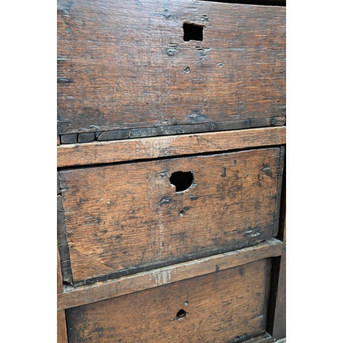 878 - A rustic late 17th/18th century joined oak framed six drawer chest, raised on stile feet, probably N... 