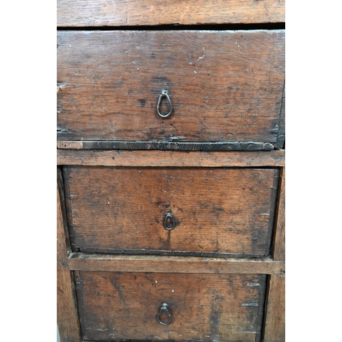 878 - A rustic late 17th/18th century joined oak framed six drawer chest, raised on stile feet, probably N... 