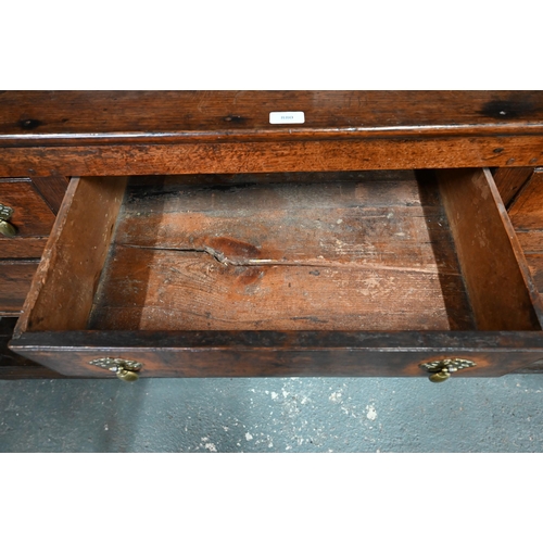 880 - An 18th century oak high dresser, the (associated) two tier rack with stepped canopy, planked back a... 