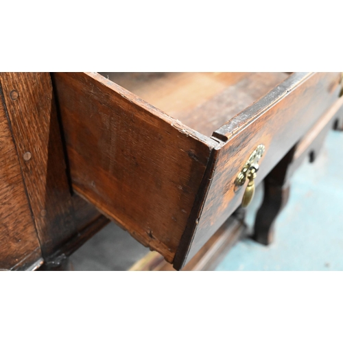 880 - An 18th century oak high dresser, the (associated) two tier rack with stepped canopy, planked back a... 