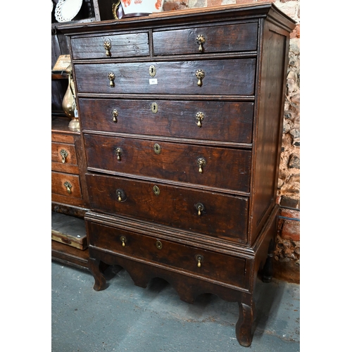 881 - A late 17th/18th century oak chest on stand, the two short over four long graduated drawers with lat... 