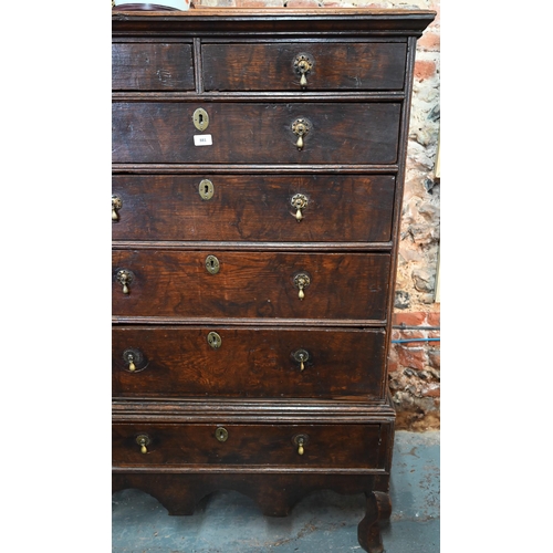 881 - A late 17th/18th century oak chest on stand, the two short over four long graduated drawers with lat... 