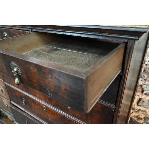 881 - A late 17th/18th century oak chest on stand, the two short over four long graduated drawers with lat... 