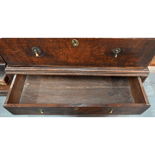 881 - A late 17th/18th century oak chest on stand, the two short over four long graduated drawers with lat... 