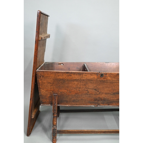 883 - An antique oak dough bin, oak and walnut, the tapered body with single plank top, raised on part tur... 