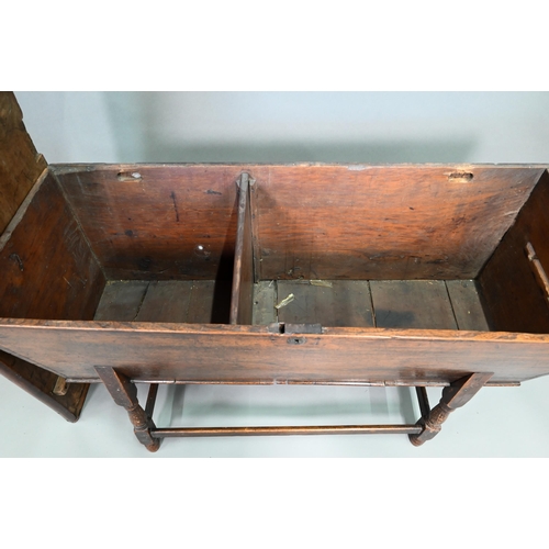 883 - An antique oak dough bin, oak and walnut, the tapered body with single plank top, raised on part tur... 