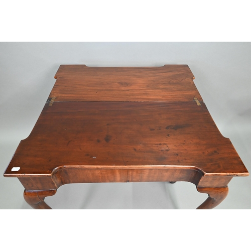 885 - A Georgian walnut folding tea table, raised on a single gateleg, on slender cabriole legs to pad fee... 