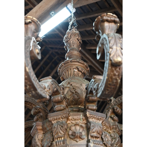 886 - A substantial Italian baroque style carved giltwood and composite eight branch chandelier, 19th cent... 