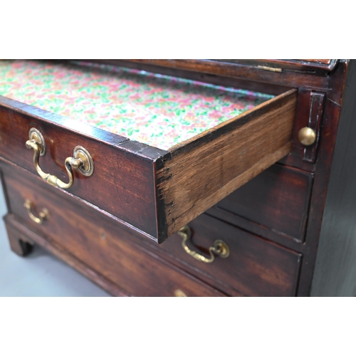 889 - A George III mahogany bureau, the well fitted interior with leather faux book spine 'secret' storage... 