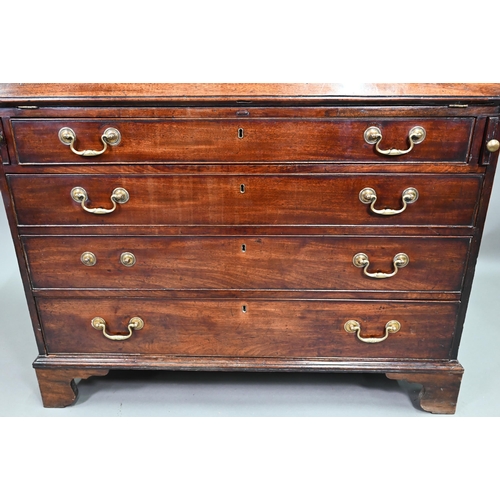 889 - A George III mahogany bureau, the well fitted interior with leather faux book spine 'secret' storage... 