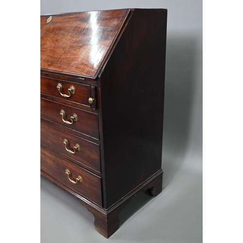 889 - A George III mahogany bureau, the well fitted interior with leather faux book spine 'secret' storage... 