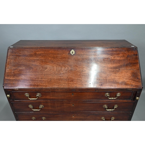 889 - A George III mahogany bureau, the well fitted interior with leather faux book spine 'secret' storage... 