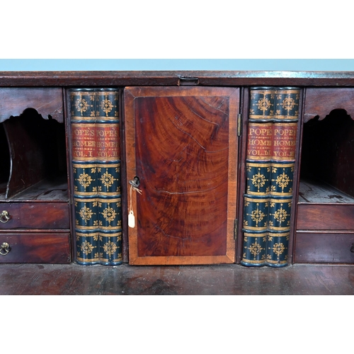 889 - A George III mahogany bureau, the well fitted interior with leather faux book spine 'secret' storage... 