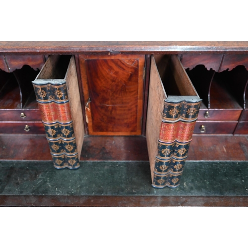 889 - A George III mahogany bureau, the well fitted interior with leather faux book spine 'secret' storage... 