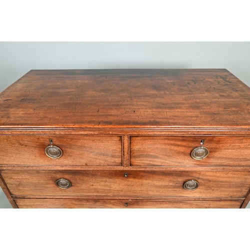 890 - A Georgian mahogany chest of two short over three long graduated drawers, raised on splay bracket fe... 