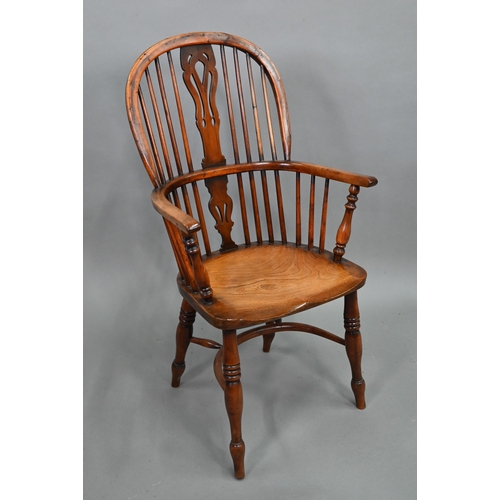 891 - An antique elm seat high splat back Windsor chair, Lincolnshire, with crinoline stretcher