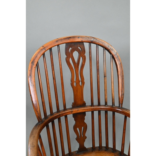 891 - An antique elm seat high splat back Windsor chair, Lincolnshire, with crinoline stretcher