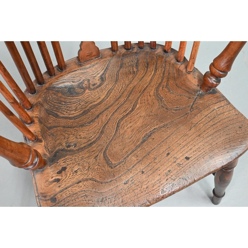 892 - An antique yew and elm Windsor high splat-back armchair, Lincolnshire, with crinoline stretcher