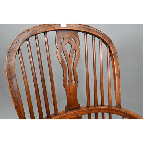 892 - An antique yew and elm Windsor high splat-back armchair, Lincolnshire, with crinoline stretcher