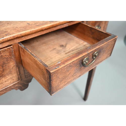 895 - An 18th century oak three drawer side table raised on square section legs