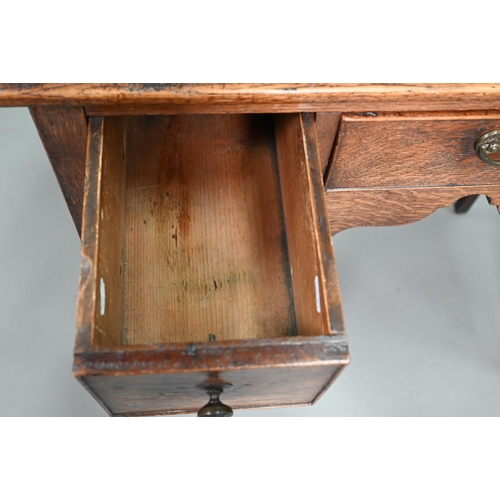 895 - An 18th century oak three drawer side table raised on square section legs