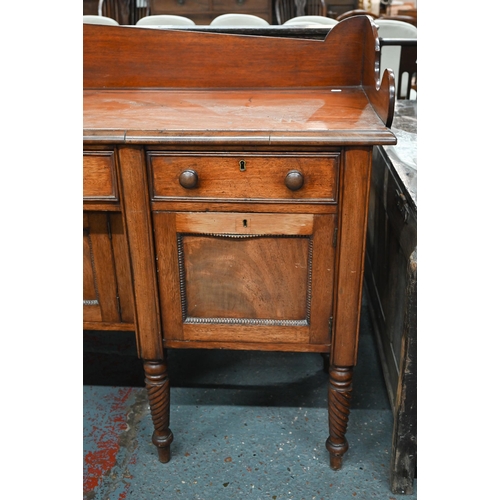 899 - A Victorian mahogany 3/4 galleried sideboard, with an arrangement of three drawers and centred by a ... 