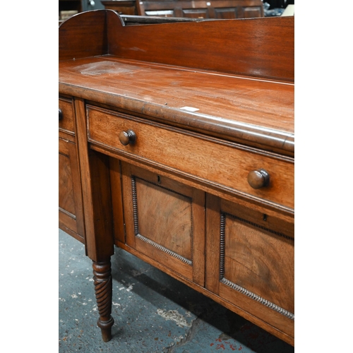 899 - A Victorian mahogany 3/4 galleried sideboard, with an arrangement of three drawers and centred by a ... 