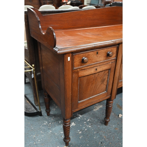 899 - A Victorian mahogany 3/4 galleried sideboard, with an arrangement of three drawers and centred by a ... 