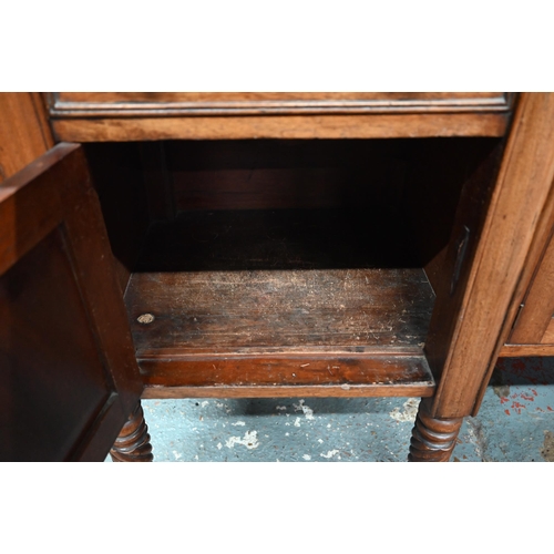 899 - A Victorian mahogany 3/4 galleried sideboard, with an arrangement of three drawers and centred by a ... 