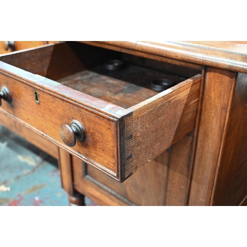 899 - A Victorian mahogany 3/4 galleried sideboard, with an arrangement of three drawers and centred by a ... 