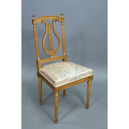 900 - A pair of 19th century Empire giltwood side/music chairs with lyre-back splats (2)