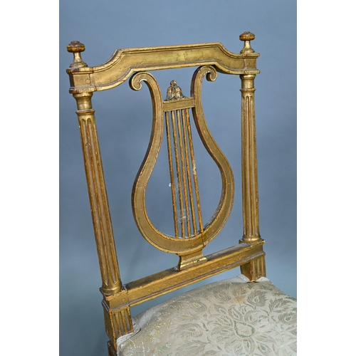 900 - A pair of 19th century Empire giltwood side/music chairs with lyre-back splats (2)