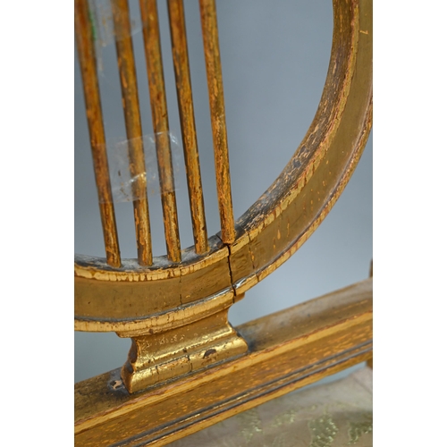 900 - A pair of 19th century Empire giltwood side/music chairs with lyre-back splats (2)