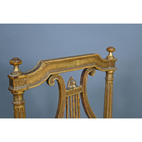 900 - A pair of 19th century Empire giltwood side/music chairs with lyre-back splats (2)