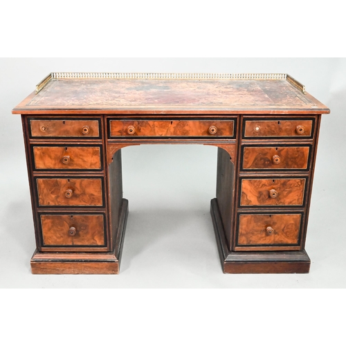 903 - A Victorian Aesthetic period ebonised and walnut pedestal desk, the tooled leather inset top with br... 