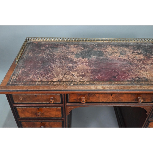 903 - A Victorian Aesthetic period ebonised and walnut pedestal desk, the tooled leather inset top with br... 